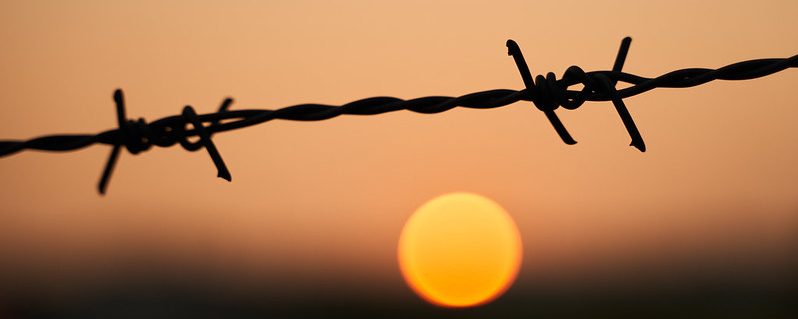 Sunset-and-Barbed-Wire-CC-by-Nico-Kaiser
